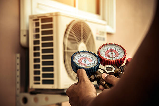 Professional Air Conditioning Service technician working in Willard, NC